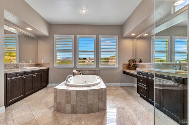 819 Bridle Ridge Dr, Fairfield, CA 94534 - full bath with healthy amount of natural light, baseboards, two vanities, a bath, and recessed lighting