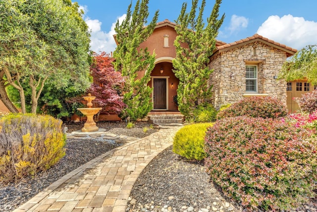 819 Bridle Ridge Dr, Fairfield, CA 94534 - view of front of house with stone siding, stucco siding, and a tiled roof