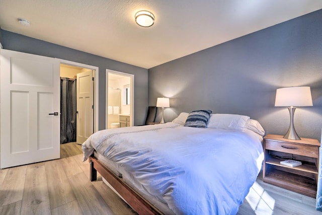 391 Tahoe Woods Blvd, Tahoe City, CA 96145 - bedroom with light wood-style flooring and ensuite bathroom