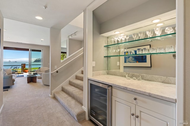 1910 Mar W St, Tiburon, CA 94920 - indoor dry bar with wine cooler, light carpet, recessed lighting, a water view, and stairway