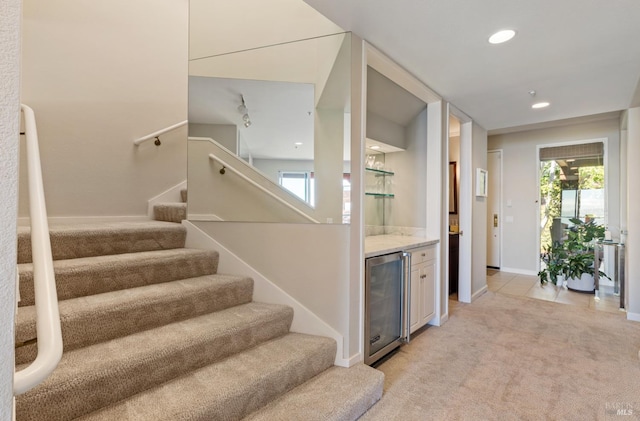 1910 Mar W St, Tiburon, CA 94920 - stairway featuring wine cooler, a dry bar, healthy amount of natural light, carpet, and recessed lighting