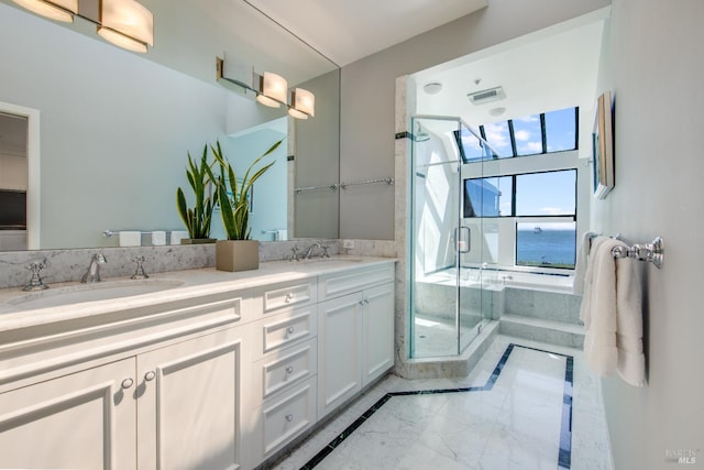 1910 Mar W St, Tiburon, CA 94920 - full bathroom featuring double vanity, a stall shower, marble finish floors, and inlaid floor details