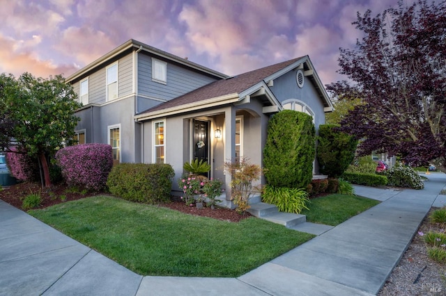 2817 Windmill Dr, Santa Rosa, CA 95403 - view of front of house with a lawn, stucco siding, and a shingled roof