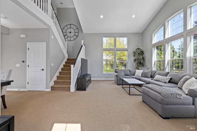 2817 Windmill Dr, Santa Rosa, CA 95403 - carpeted living area featuring high vaulted ceiling, baseboards, stairway, and recessed lighting