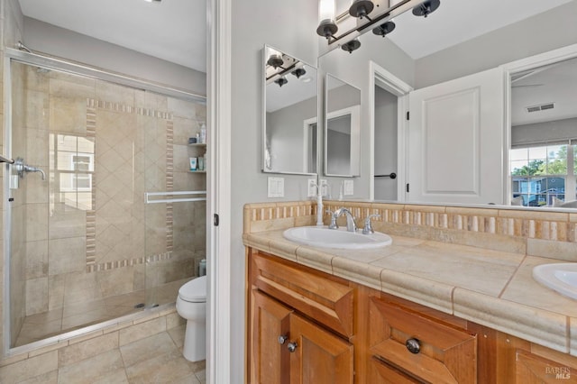 2817 Windmill Dr, Santa Rosa, CA 95403 - full bathroom featuring double vanity, a stall shower, and toilet