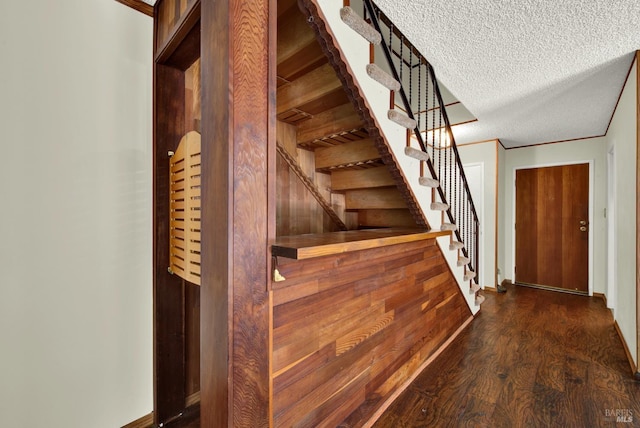 970 El Camino Ave Unit 3, Vacaville, CA 95688 - stairway featuring wood finished floors, a textured ceiling, and baseboards