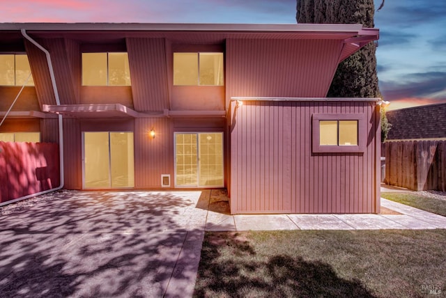 970 El Camino Ave Unit 3, Vacaville, CA 95688 - back of property at dusk featuring fence and a patio