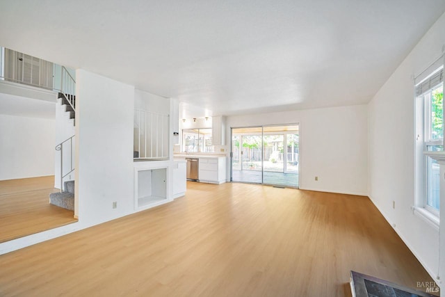 5705 Dexter Cir, Rohnert Park, CA 94928 - unfurnished living room featuring light wood-style floors and stairs