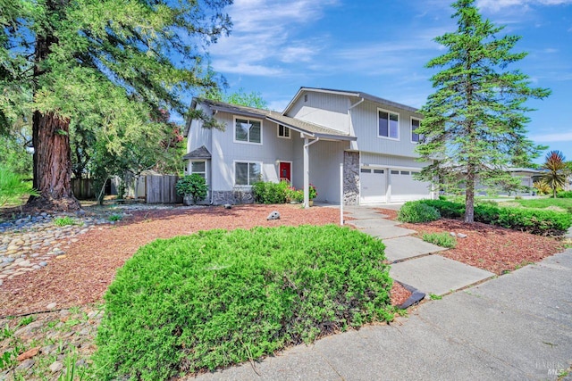 5705 Dexter Cir, Rohnert Park, CA 94928 - view of front of house with a garage, fence, concrete driveway, and stone siding