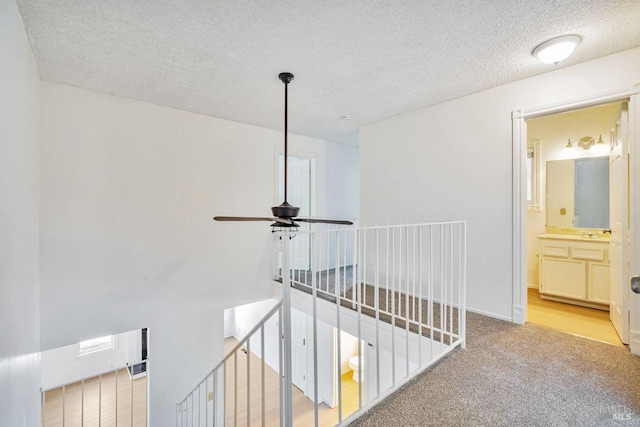 5705 Dexter Cir, Rohnert Park, CA 94928 - corridor featuring an upstairs landing, carpet flooring, and a textured ceiling