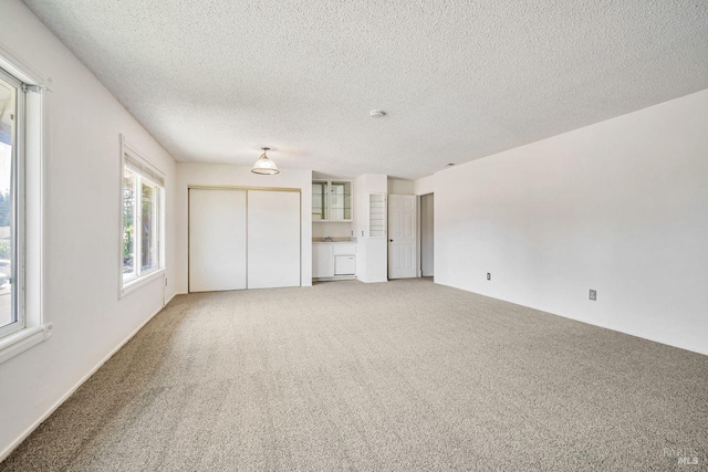 5705 Dexter Cir, Rohnert Park, CA 94928 - unfurnished living room featuring carpet floors and a textured ceiling