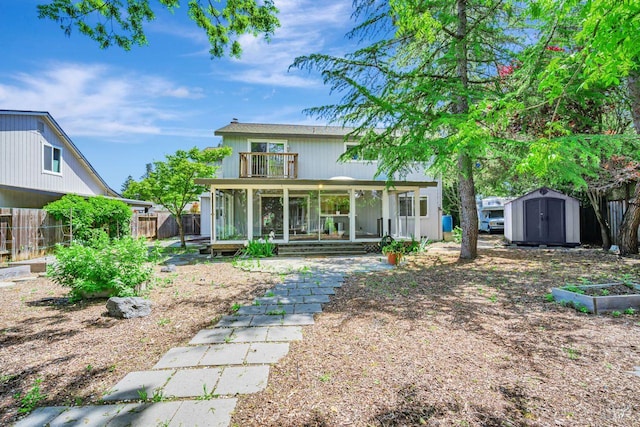 5705 Dexter Cir, Rohnert Park, CA 94928 - rear view of house with a balcony, a storage shed, a fenced backyard, an outdoor structure, and covered porch