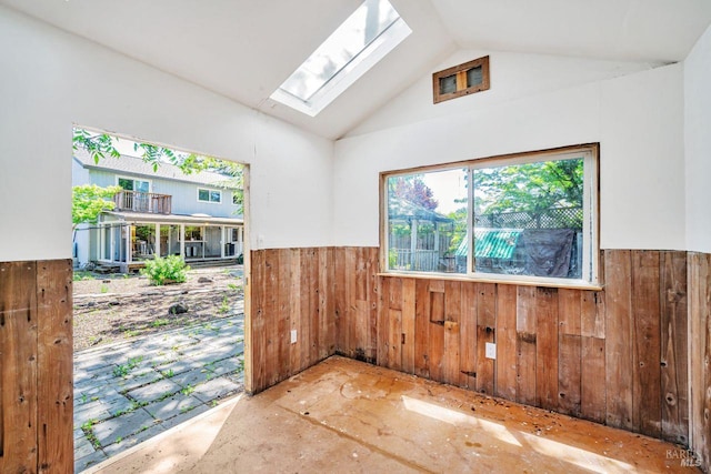 5705 Dexter Cir, Rohnert Park, CA 94928 - spare room with a skylight, wainscoting, wood walls, and vaulted ceiling