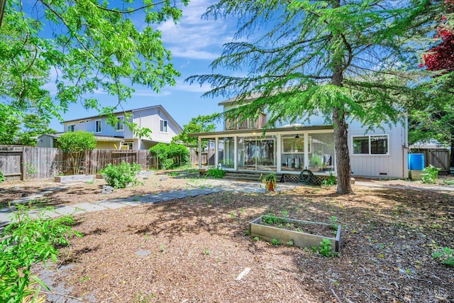 5705 Dexter Cir, Rohnert Park, CA 94928 - back of house featuring a vegetable garden, a ceiling fan, a fenced backyard, crawl space, and a sunroom