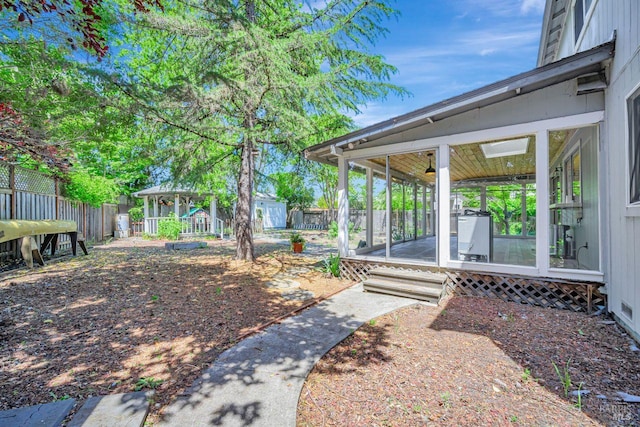 5705 Dexter Cir, Rohnert Park, CA 94928 - view of yard with fence, a sunroom, a gazebo, and an outbuilding
