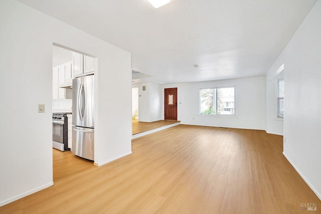 5705 Dexter Cir, Rohnert Park, CA 94928 - unfurnished living room featuring light wood finished floors and baseboards