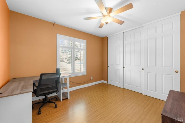 2648 Nut Tree Rd, Vacaville, CA 95687 - home office with light wood-style floors, a ceiling fan, and baseboards