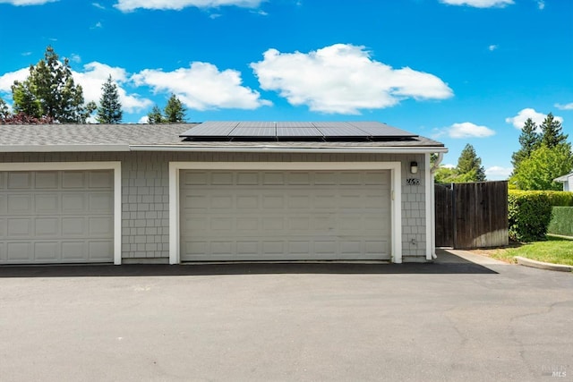 2648 Nut Tree Rd, Vacaville, CA 95687 - garage with solar panels and fence