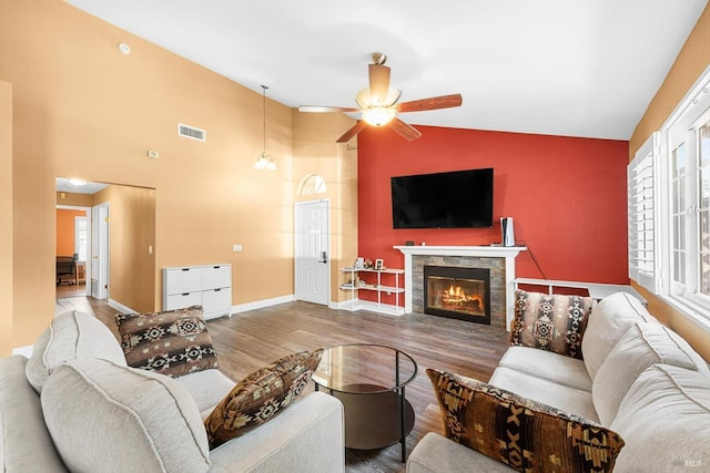 2648 Nut Tree Rd, Vacaville, CA 95687 - living room with ceiling fan, a fireplace, healthy amount of natural light, wood finished floors, and high vaulted ceiling