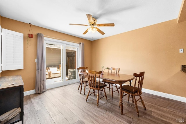 2648 Nut Tree Rd, Vacaville, CA 95687 - dining area featuring a ceiling fan, wood finished floors, and baseboards