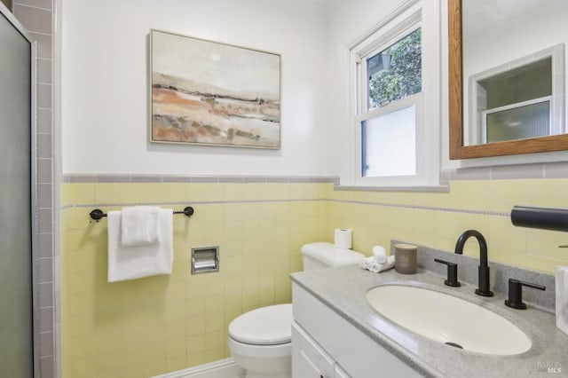 1400 High School Rd, Sebastopol, CA 95472 - bathroom with a stall shower, tile walls, toilet, vanity, and a wainscoted wall