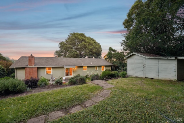 1400 High School Rd, Sebastopol, CA 95472 - view of front of house featuring a chimney, a lawn, an outbuilding, and a shed