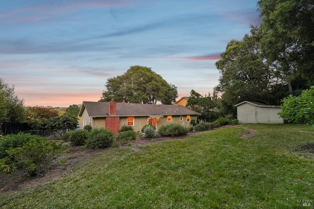 1400 High School Rd, Sebastopol, CA 95472 - yard at dusk featuring a lawn, a storage unit, and an outdoor structure