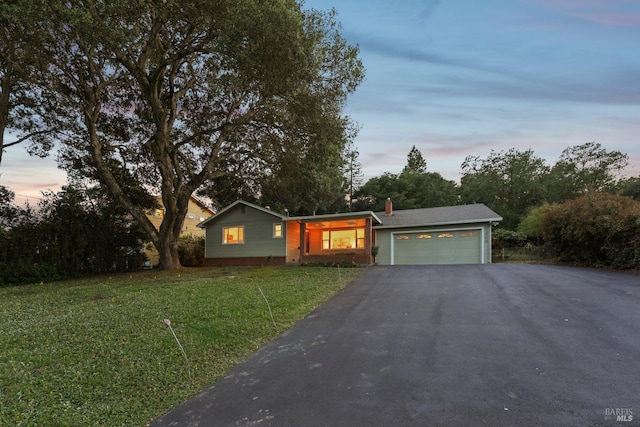 1400 High School Rd, Sebastopol, CA 95472 - single story home featuring a garage, asphalt driveway, a lawn, and a chimney