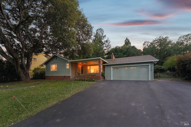 1400 High School Rd, Sebastopol, CA 95472 - ranch-style home featuring a garage, asphalt driveway, a front yard, and a chimney