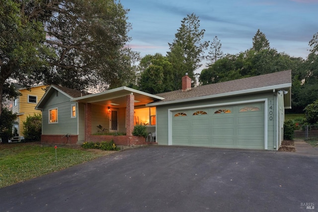 1400 High School Rd, Sebastopol, CA 95472 - ranch-style house with a garage, a chimney, brick siding, covered porch, and driveway