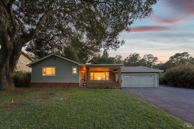 1400 High School Rd, Sebastopol, CA 95472 - ranch-style home featuring asphalt driveway, an attached garage, a front lawn, and brick siding