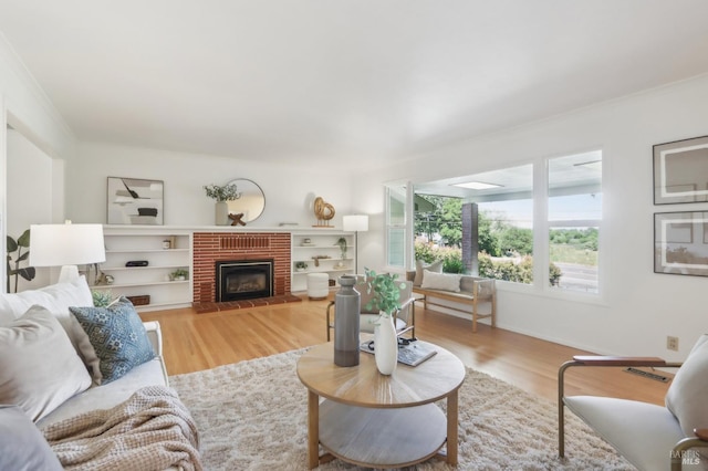 1400 High School Rd, Sebastopol, CA 95472 - living area with wood finished floors, a fireplace, crown molding, and baseboards