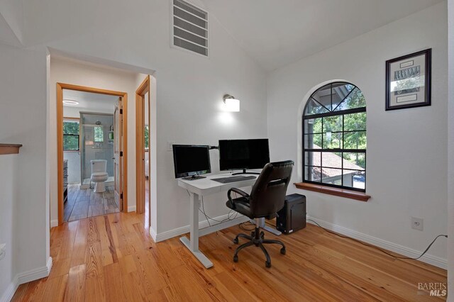 7293 Occidental Rd, Sebastopol, CA 95472 - office space featuring light wood-style flooring, lofted ceiling, and baseboards