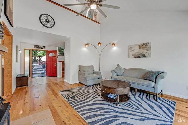 7293 Occidental Rd, Sebastopol, CA 95472 - living area featuring ceiling fan, light wood-style flooring, baseboards, and a towering ceiling