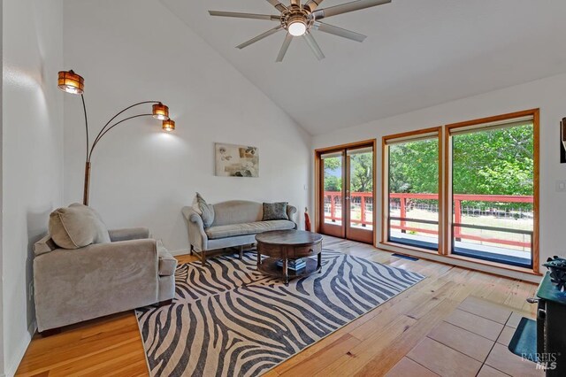 7293 Occidental Rd, Sebastopol, CA 95472 - living room featuring light wood-style flooring, ceiling fan, and high vaulted ceiling