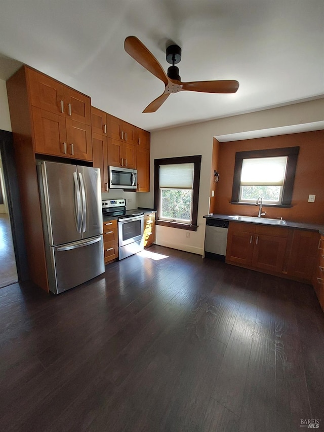1011 Georgia St, Vallejo, CA 94590 - kitchen featuring appliances with stainless steel finishes, a sink, brown cabinets, and ceiling fan