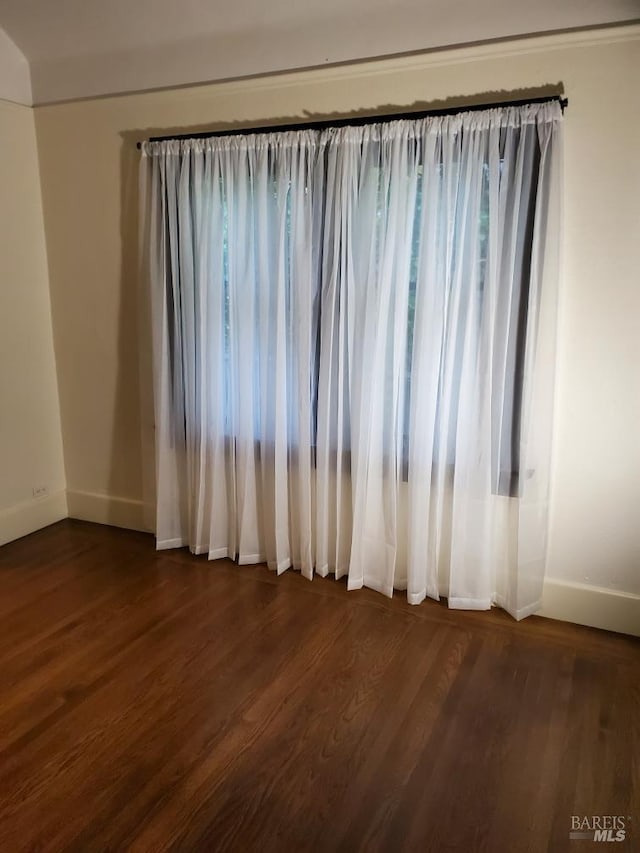 1011 Georgia St, Vallejo, CA 94590 - spare room featuring baseboards and dark wood-style flooring