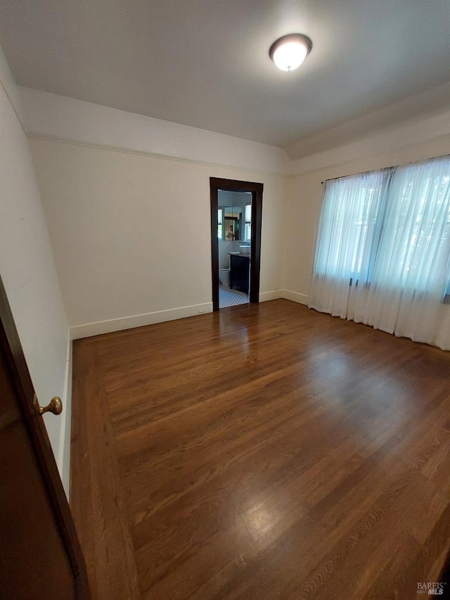 1011 Georgia St, Vallejo, CA 94590 - unfurnished room with dark wood-type flooring, healthy amount of natural light, and baseboards