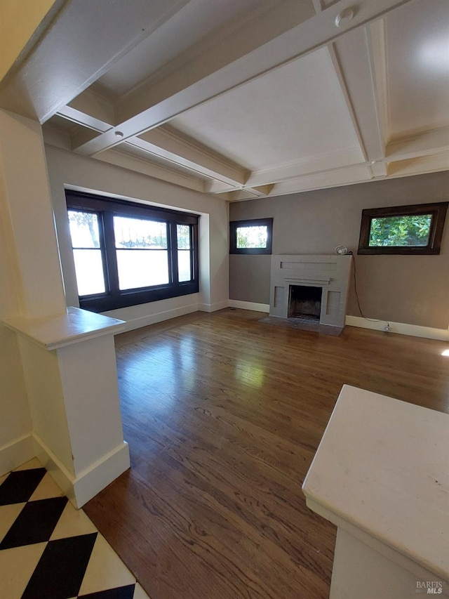 1011 Georgia St, Vallejo, CA 94590 - unfurnished living room with baseboards, a fireplace with flush hearth, coffered ceiling, beam ceiling, and wood finished floors