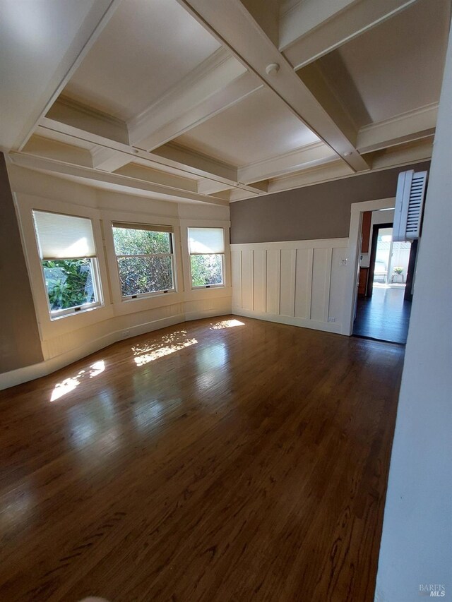 1011 Georgia St, Vallejo, CA 94590 - unfurnished room with coffered ceiling, beam ceiling, dark wood-style flooring, wainscoting, and a decorative wall