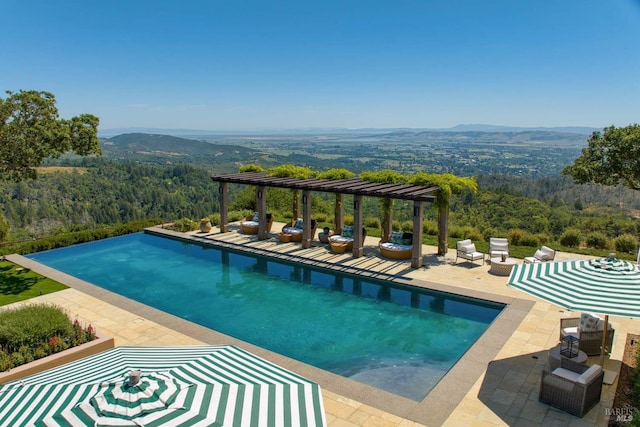 17256 7th St E, Sonoma, CA 95476 - view of pool featuring a pergola, a mountain view, an infinity pool, and a patio area