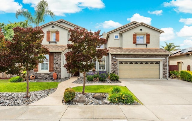 201 Red Pheasant Dr, Vacaville, CA 95687 - view of front of property with stone siding, a tiled roof, driveway, an attached garage, and stucco siding