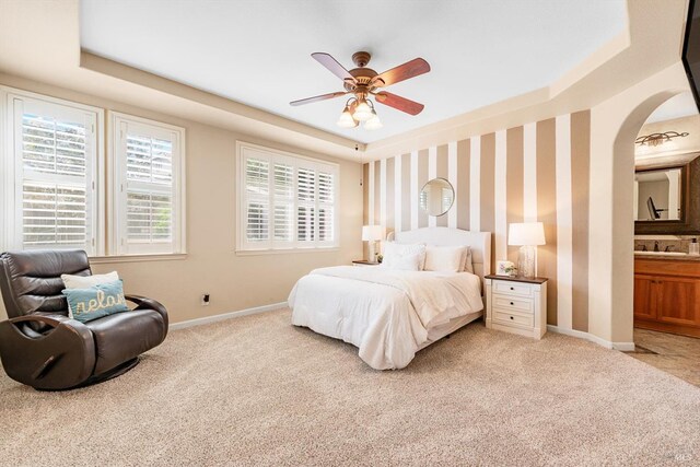 201 Red Pheasant Dr, Vacaville, CA 95687 - bedroom with a tray ceiling, light colored carpet, baseboards, and arched walkways