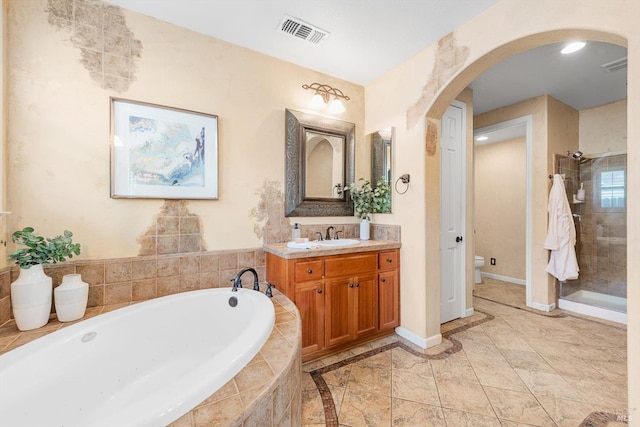 201 Red Pheasant Dr, Vacaville, CA 95687 - full bathroom featuring a bath, a shower stall, baseboards, vanity, and toilet