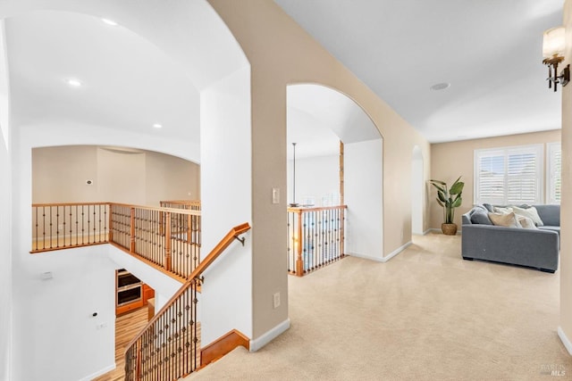 201 Red Pheasant Dr, Vacaville, CA 95687 - corridor with an upstairs landing, arched walkways, carpet flooring, baseboards, and recessed lighting