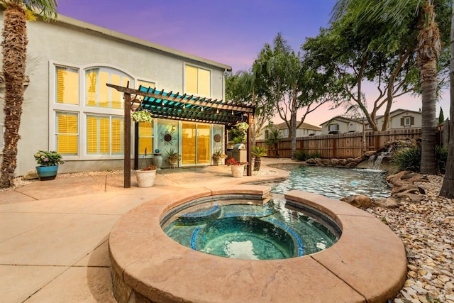 201 Red Pheasant Dr, Vacaville, CA 95687 - pool at dusk featuring an in-ground hot tub, a pergola, a patio area, and a fenced backyard