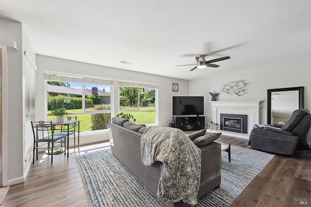 448 Meadowgreen Dr, Santa Rosa, CA 95409 - living room with ceiling fan, wood finished floors, a fireplace, and baseboards