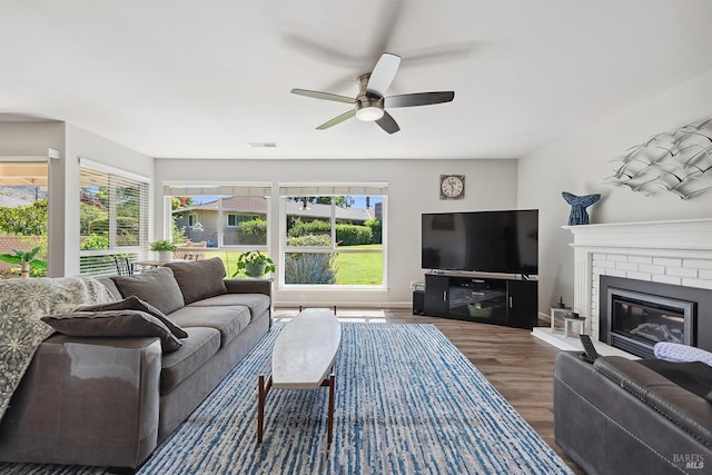 448 Meadowgreen Dr, Santa Rosa, CA 95409 - living area featuring wood finished floors, a ceiling fan, baseboards, and a brick fireplace