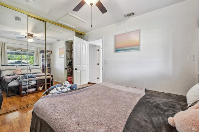 548 Bass Dr, Vacaville, CA 95687 - bedroom featuring attic access, a closet, a ceiling fan, and wood finished floors