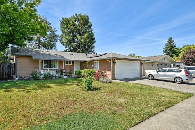 548 Bass Dr, Vacaville, CA 95687 - ranch-style home with a garage, roof mounted solar panels, and driveway